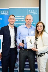 Eco-friendly detergent industry professionals at European conference, showcasing sustainable practic.